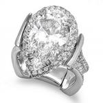 Custom pear shape diamond wedding ring with round diamonds