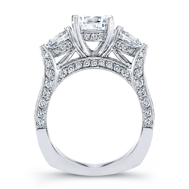 Three stone engagement ring with pavee set diamonds 